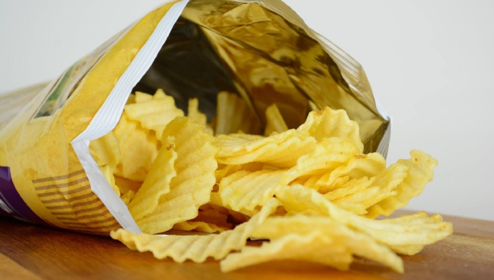 Although the inside of conventional crisp packets are shiny and look like foil, they are in fact a metallised plastic film